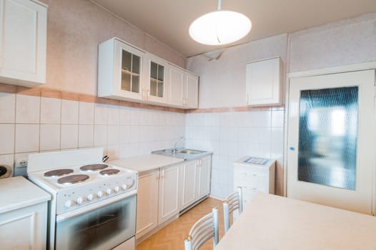 Russia, Moscow- July 23, 2019: interior room apartment. standard repair decoration in hostel. modern kitchen, dining area