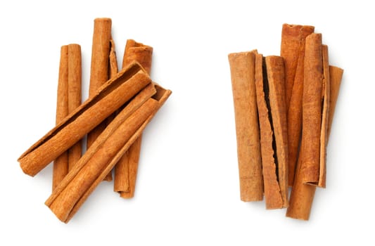 Cinnamon sticks isolated on white background. Top view. Flat lay