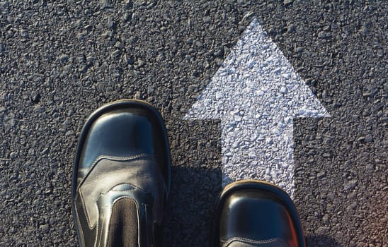 Shoes standing at the crossroad and get to decision which way to go. Ways to choose concept.