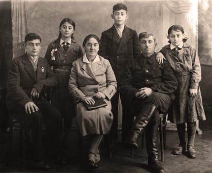 Family portrait, people of all ages, circa 1930.