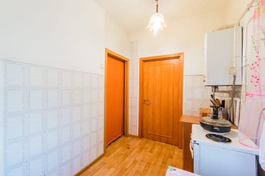 Russia, Moscow- July 25, 2019: interior room apartment. standard repair decoration in hostel. kitchen and dining room