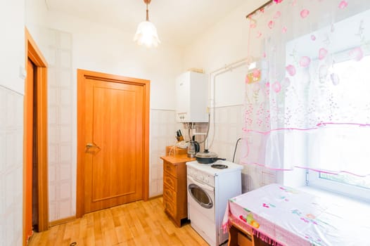 Russia, Moscow- July 25, 2019: interior room apartment. standard repair decoration in hostel. kitchen and dining room
