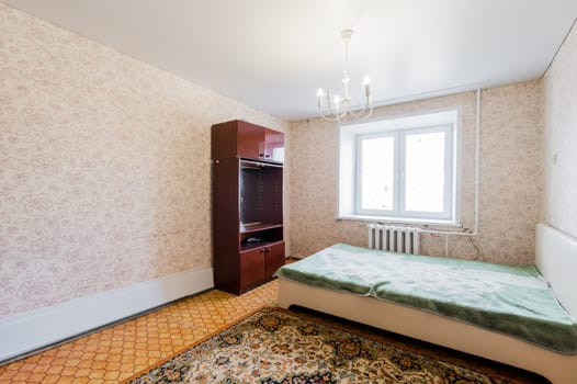 Russia, Moscow- July 23, 2019: interior room apartment. standard repair decoration in hostel. decrepit old careless not modern setting. cosmetic repairs required