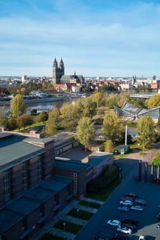 Aerial view of an event building in the Rotehornpark in Magdeburg. In the background the Magdeburg Cathedral.