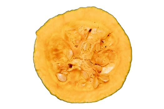 Sliced pumpkin isolated. Close-up of a yellow fresh pulp with seeds of a sliced pumpkin isolated on a white background. Macro photograph.