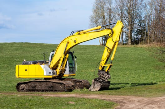 The old excavator stay in the field after works