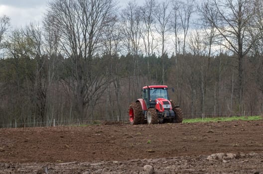 The tractor working on the large field