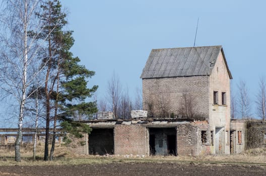 An old abandoned building on a abandoned farmstead.