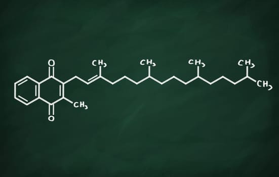 Structural model of Vitamin K on the blackboard.