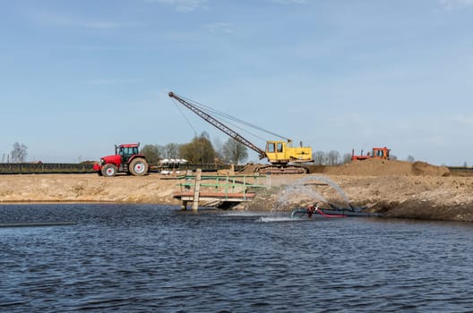 Tractor and excavator stay in the after hard work