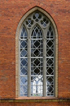 The old window in the red brick wall.