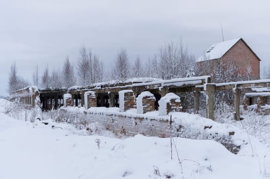 Terrible and scary abandoned farm house in winter period