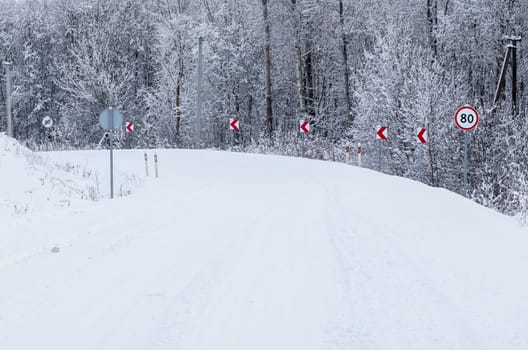 Road covered winter snow in the forest