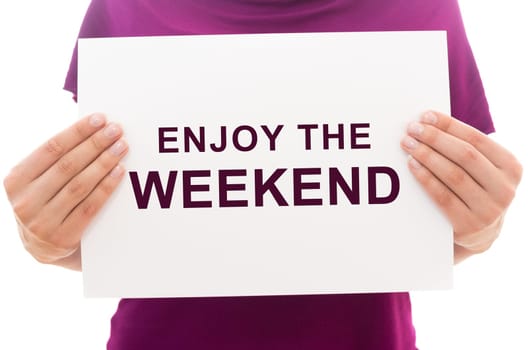 Girl holding white paper sheet with text ENJOY THE WEEKEND