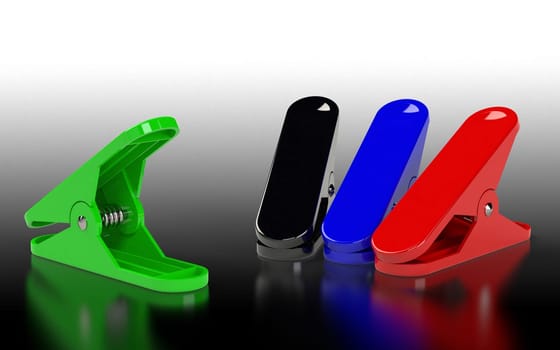 Several clippers of different colours placed on the grey background. 3D rendering