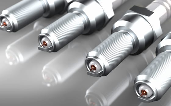 Several spark plugs on the grey background. 3D rendering.