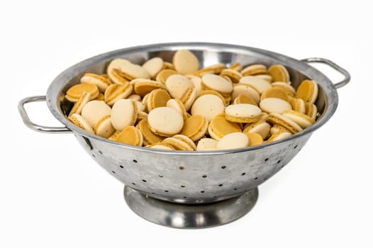 Homemade anise christmas cookies in a metal bowl isolated on white