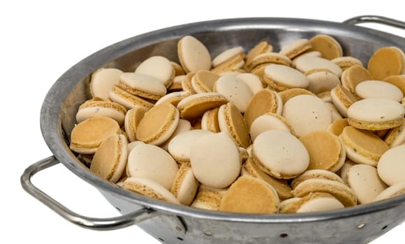 Homemade anise christmas cookies in a metal bowl isolated on white