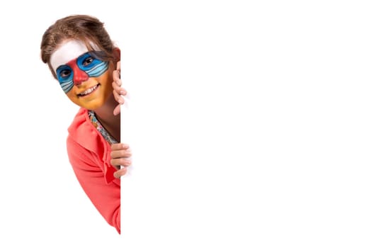 Girl with animal face-paint over a white board, isolated in white