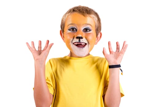 Boy with lion face-paint behind a white board