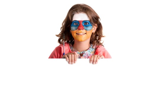 Girl with animal face-paint over a white board, isolated in white