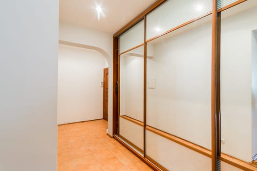 Russia, Moscow- August 01, 2019: interior room apartment. standard repair decoration in hostel. corridor, hallway, doors and mirrors