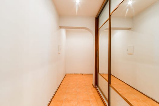 Russia, Moscow- August 01, 2019: interior room apartment. standard repair decoration in hostel. corridor, hallway, doors and mirrors
