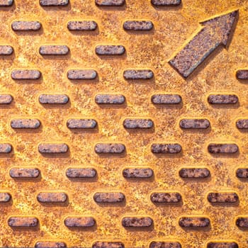 Steel rusty texture from Manhole cover. Orange metallic background.