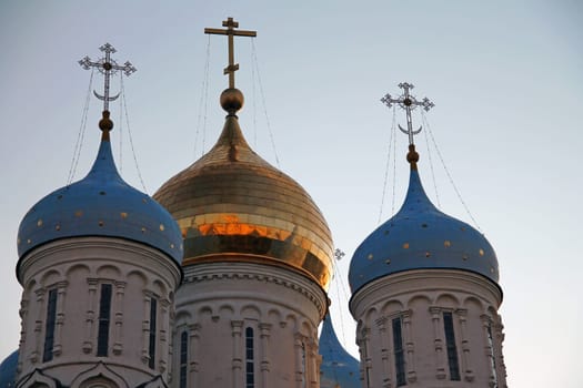 The teal and golden domes of The Holy Trinity