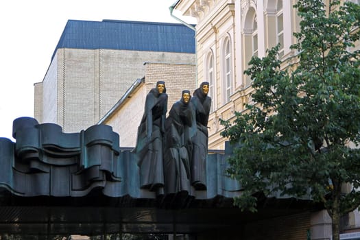 The dark sculptures at the entrance of the Vilnius theater