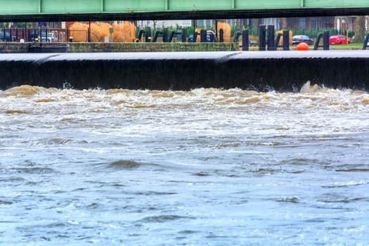ESSEN, NRW, GERMANY - FEBRUARY 04, 2016:.Severe flooding in the river of the Ruhr near the city.Essen Kettwig by storm, wind and heavy rain..