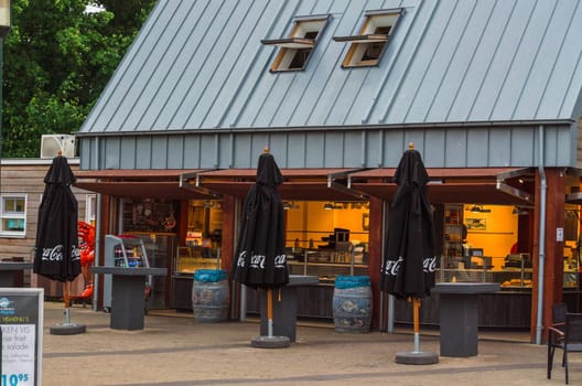RENESSE, ZEELAND, THE NETHERLANDS - JUNE 14 2015:.Renesse, Zeeland, The Netherlands - June 14 2015:.Renesse city center on the main street overlooking a restaurant.