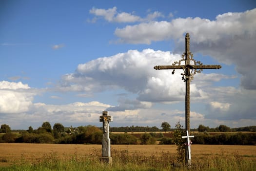 The two crosses in the prairie with the clouds