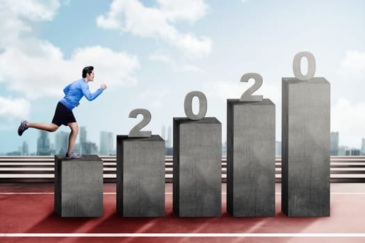 Asian man running on the 2020 stairs. Happy New Year 2020