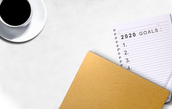 Empty list for 2020 goals in the paper on the desk. Goals of 2020. Happy New Year 2020