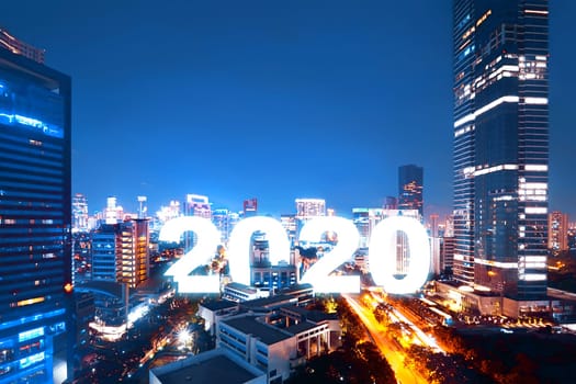 2020 on the city with a night scene background. Happy New Year 2020