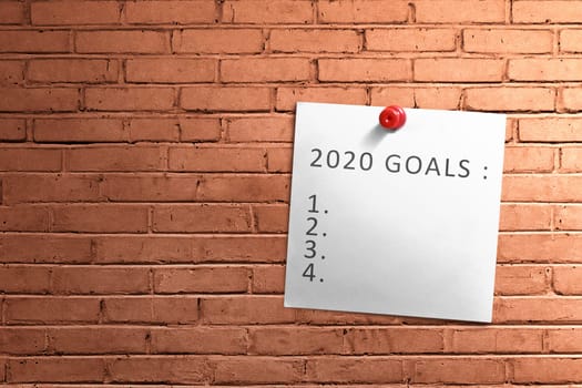 Empty list for 2020 goals in the paper pinned on the wall. Goals of 2020. Happy New Year 2020