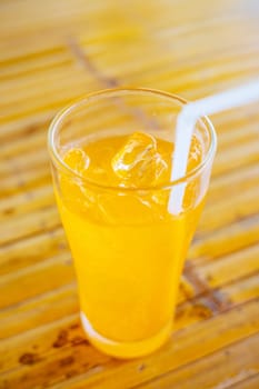 Glass water drink cool with tube on table blurred background