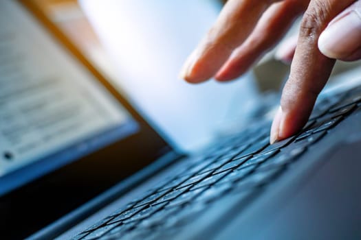 Technology and connecting concept, Hand human with keyboard on notebook computer blurred background