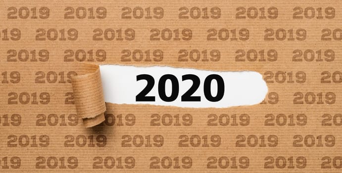 Torn paper revealing the number 2020
