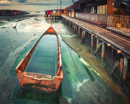 Beautiful view of sunrise at Penang. Boat on the foreground.  Malaysia