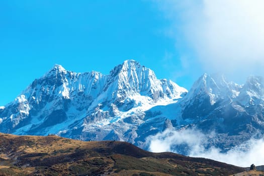 Campsite with tents on the top of high mountains, covered by snow. Kangchenjunga, India.