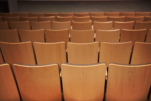 Empty brown chairs in the cinema interior