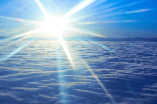 Amazing view from plane on the sky, sunset sun and clouds