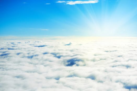 Blue sky and clouds. Plane view above the earth, can be used for background