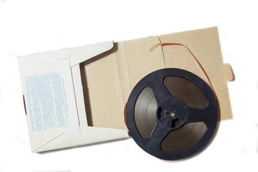 Vintage magnetic audio tape, reel to reel type, paper box on the white background