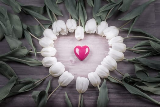 Beautiful heart shape on wood in decoration one at one tulip. Wonderful gift for e.g. valentine's day, mother's day, wedding, birthday or anniversary.
