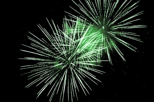 Premium entertainment magic star firework at e.g. New Years Eve or Independence Day party celebration. Black background copyspace.