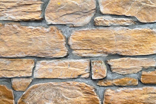 Yellow stone tiles at external wall