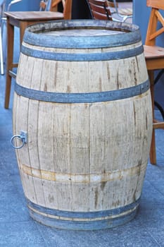 Old oak barrel in front of caffee
